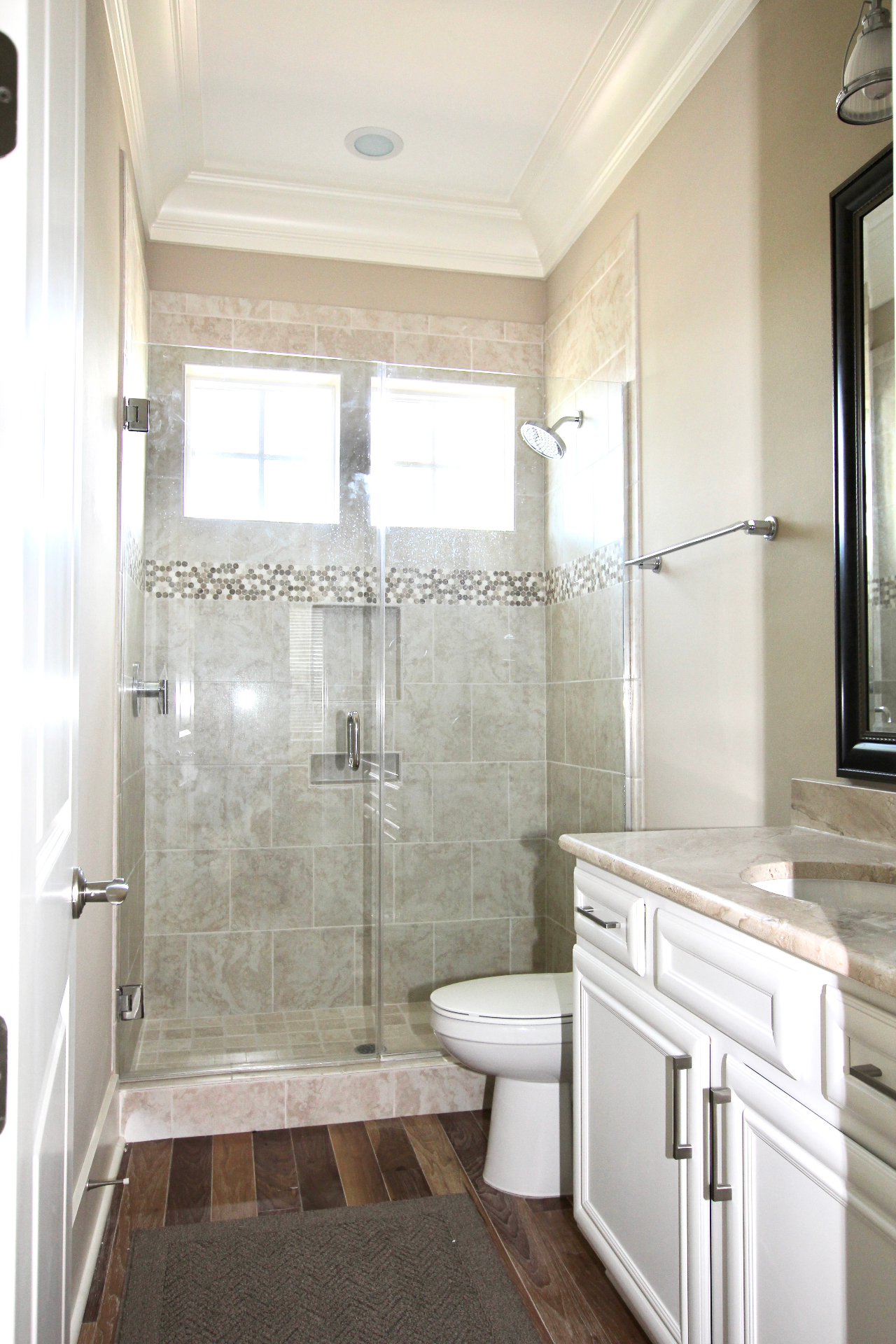 Guest Bathroom with Tiled Walk-In Shower and Vanity