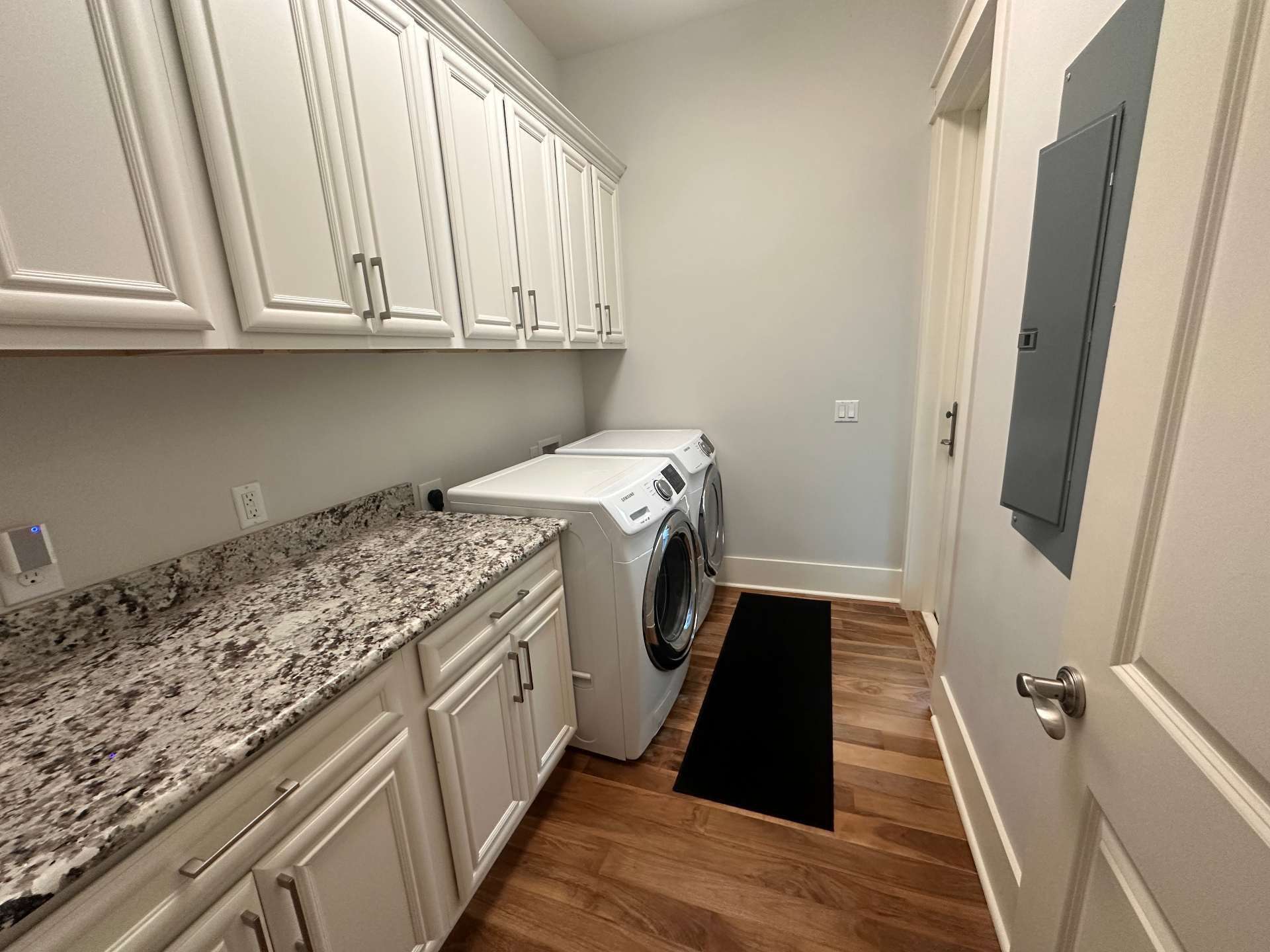 Full Laundry Room with Granite Counters — Pack Light, Wash Here