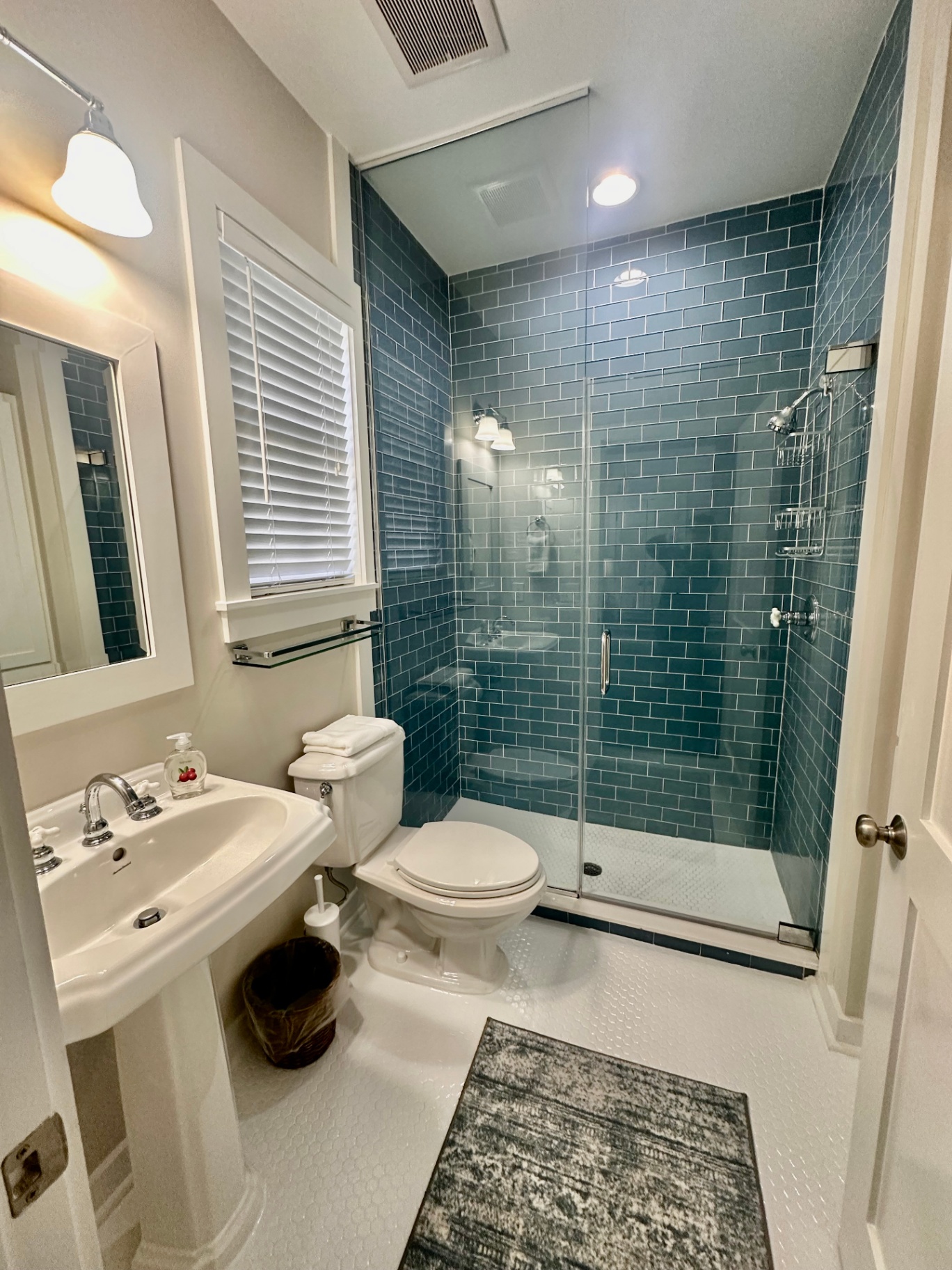 Primary Bathroom with Walk-In Glass Tile Shower